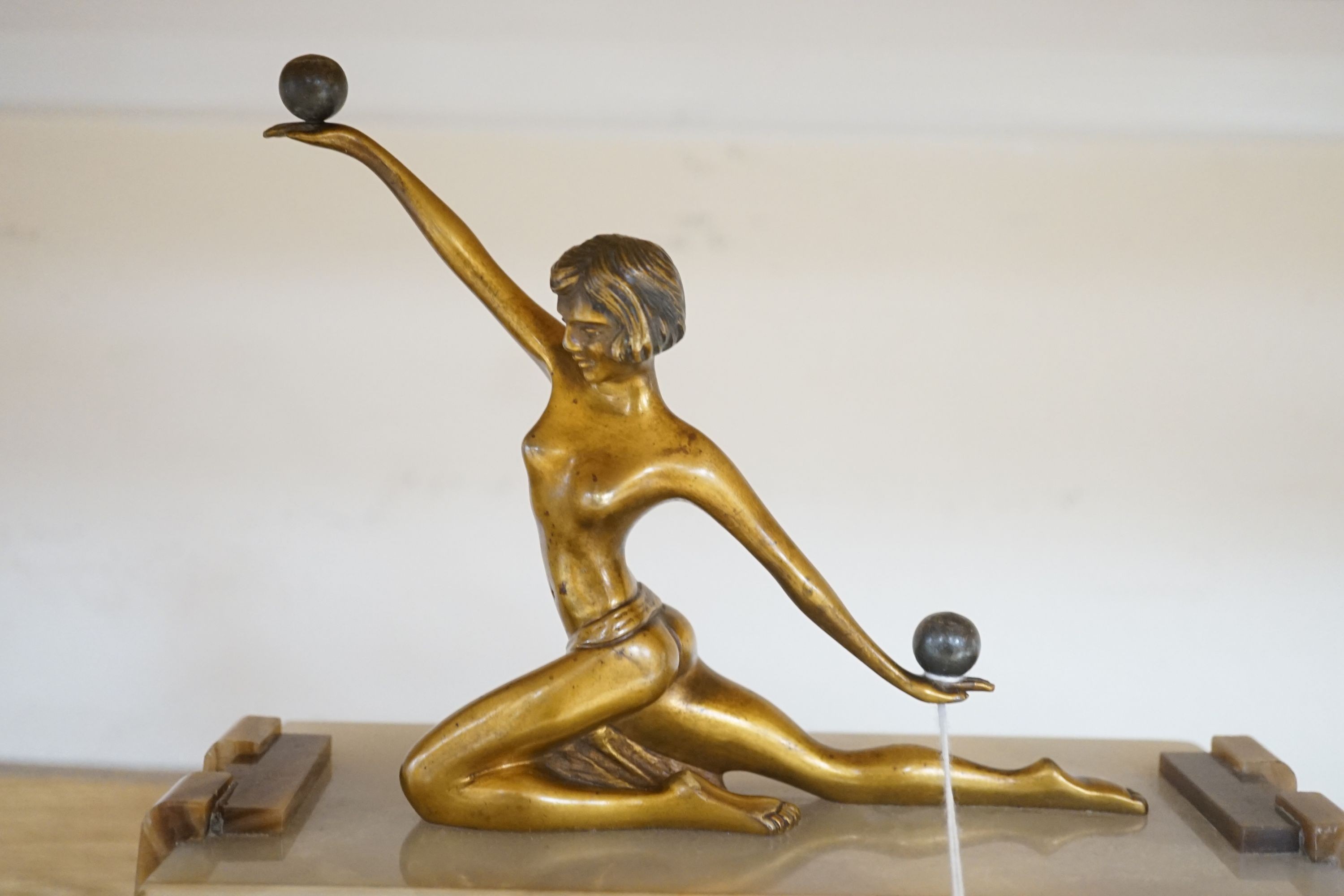 An Art Deco marble and bronze figural clock 52cm